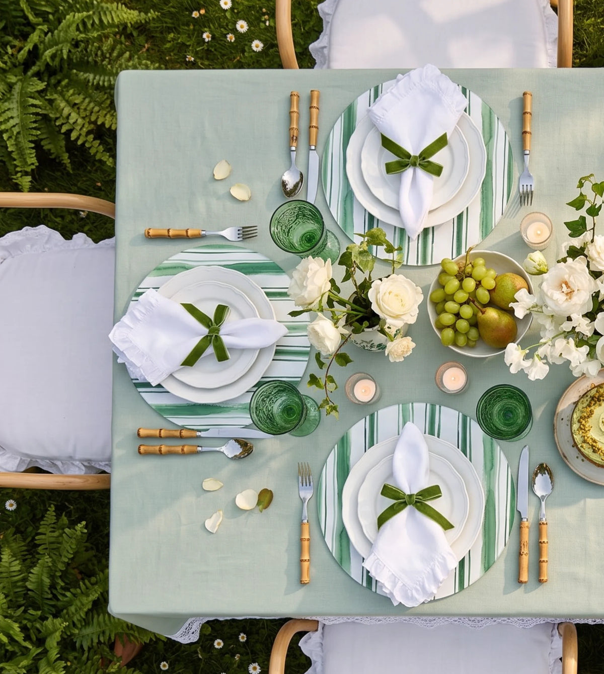 Garden Green Striped placemats on a laid table, seen from above
