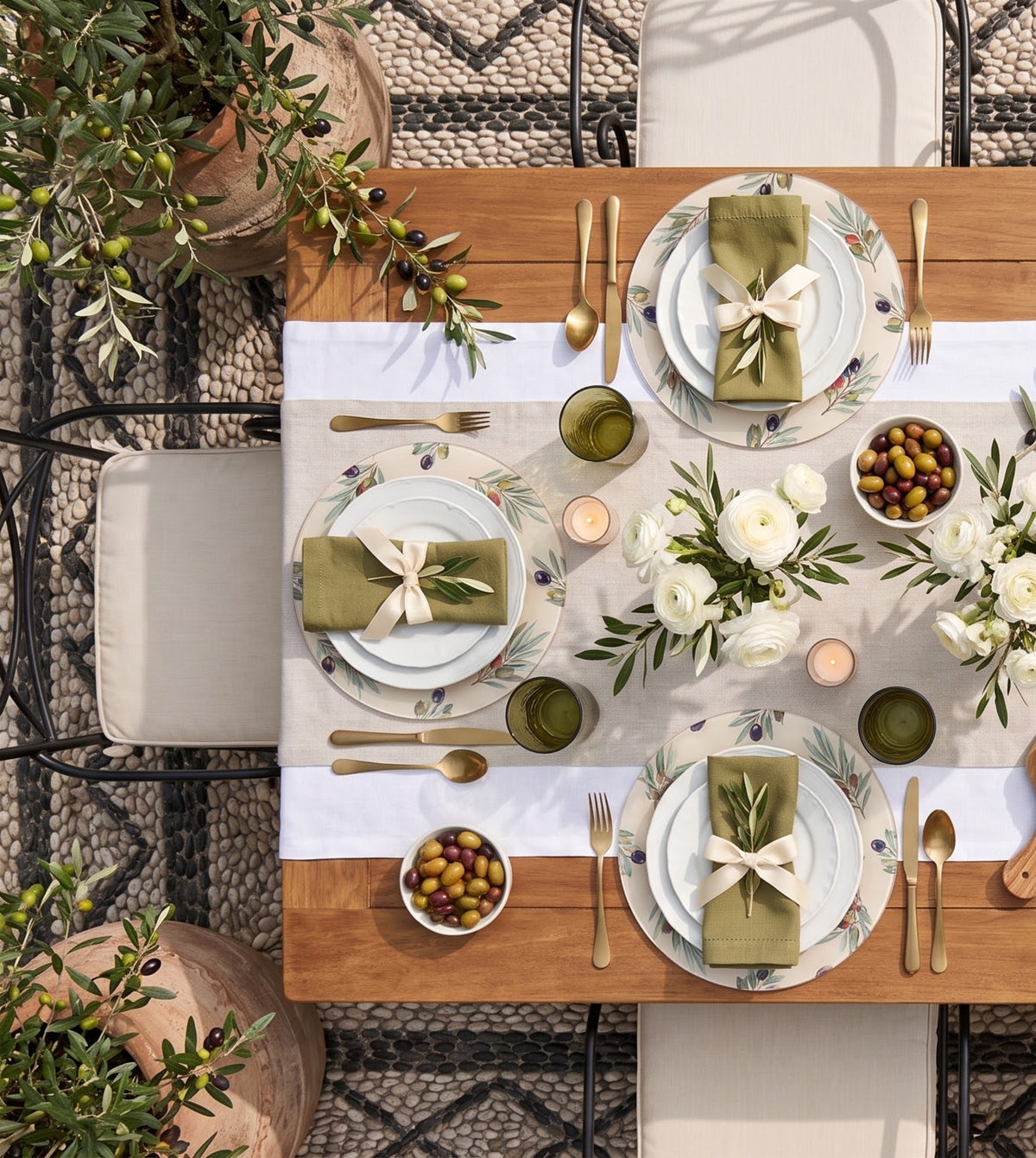 Olive Branch placemats on a laid table, seen from above