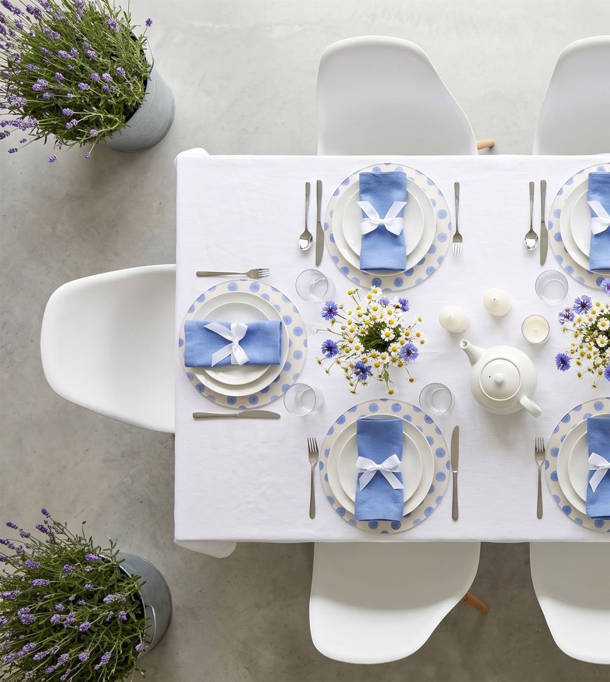 Blue Polka Dot placemats on a laid table, seen from above