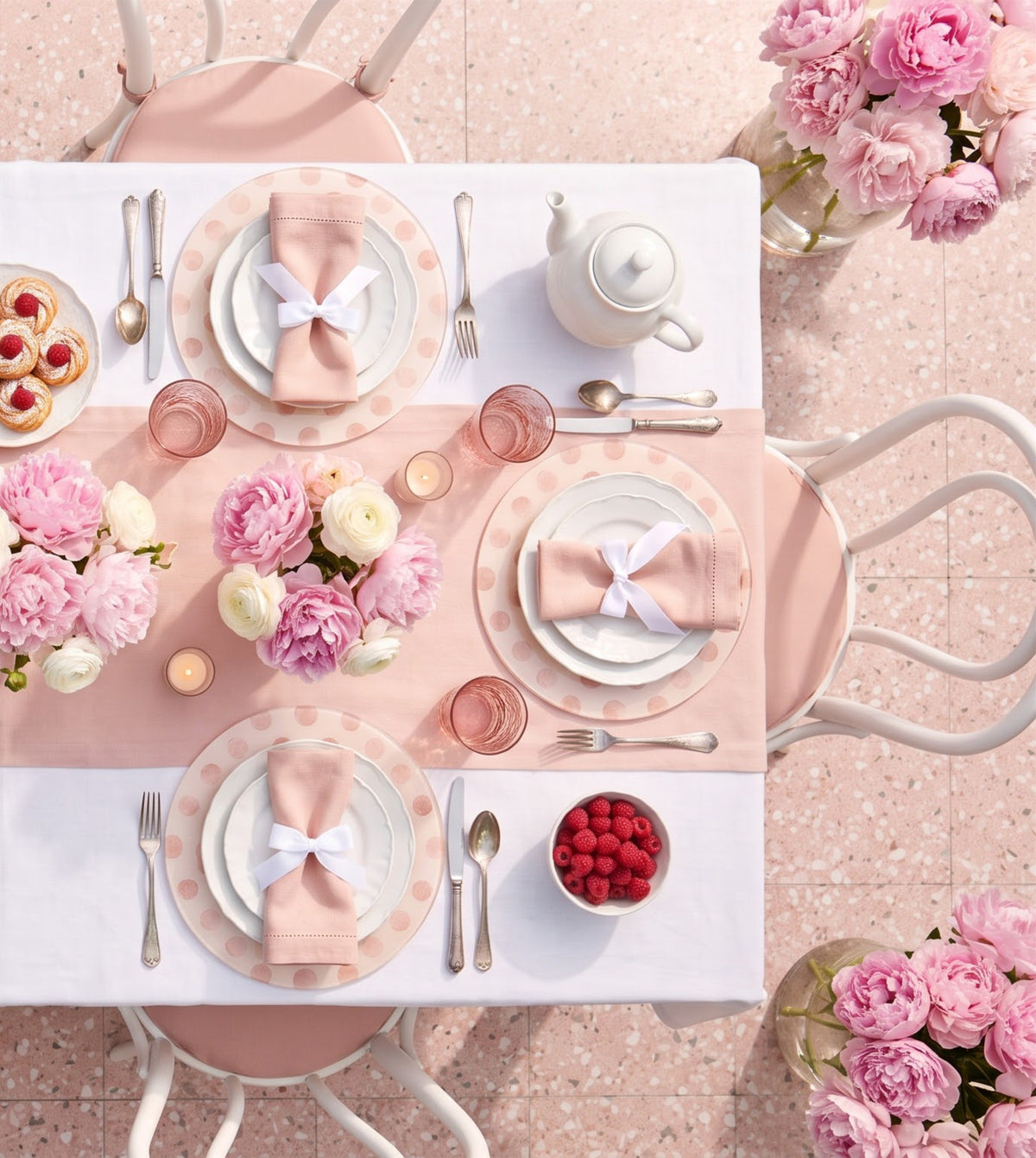 Pink Polka round acrylic placemats on a laid table