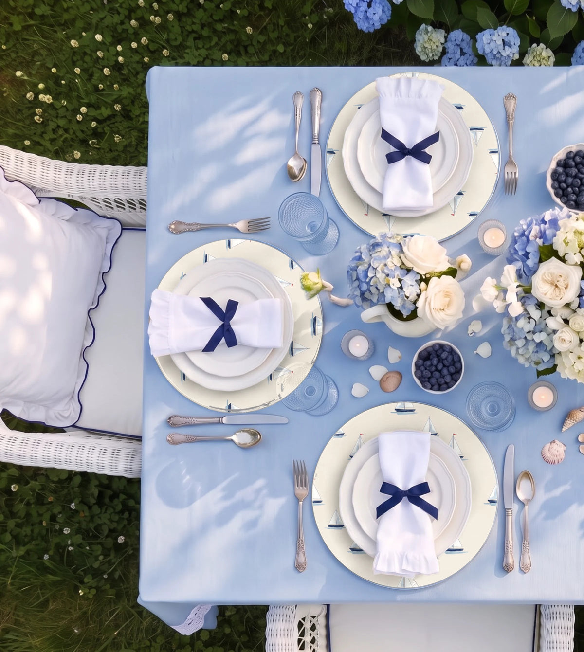 Regatta Sailboat Nautical placemats on a laid table, seen from above