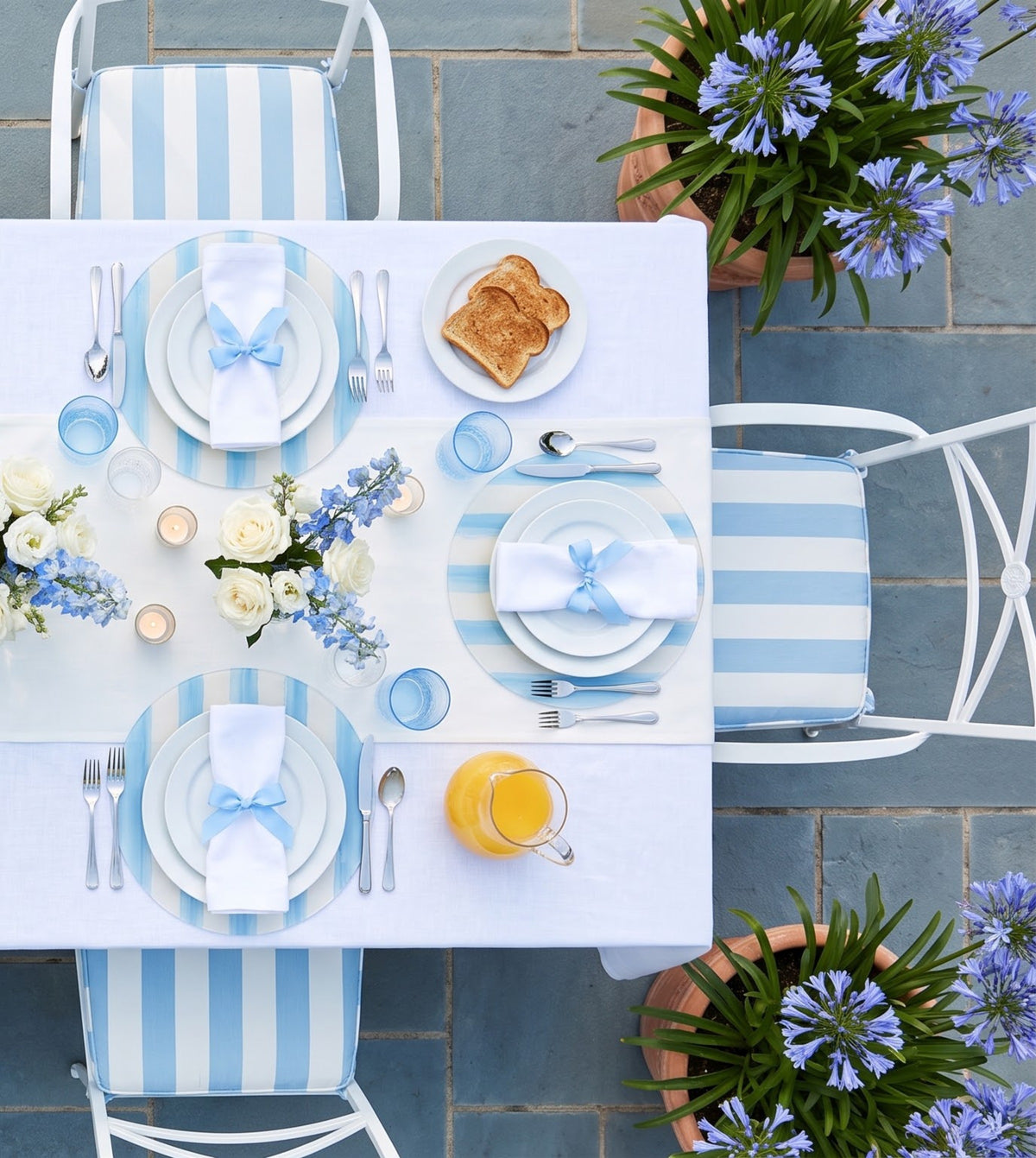 Sky Blue and White Striped round placemats, set of six on a table